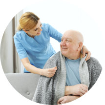 a caregiver woman with a man smiling